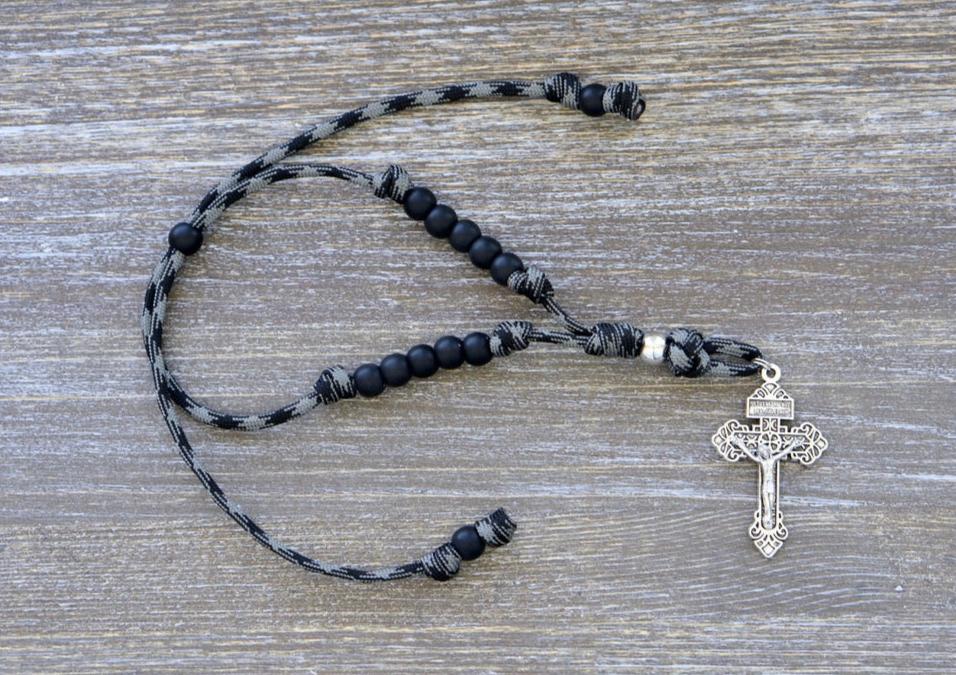 Catholic rearview mirror rosary "The Demon Destroyer" with matte black Hail Mary beads, silver Our Father and Pardon crucifix, made from strong paracord in black and grey pattern.