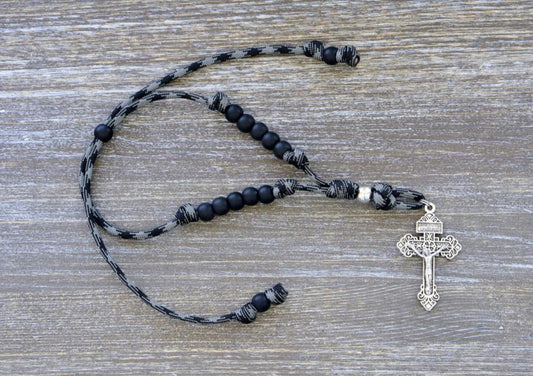 Catholic rearview mirror rosary "The Demon Destroyer" with matte black Hail Mary beads, silver Our Father and Pardon crucifix, made from strong paracord in black and grey pattern.