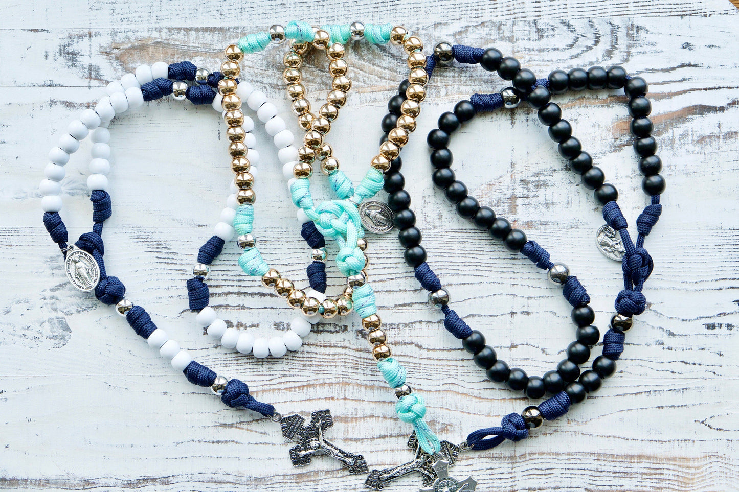 Customize your own 5 Decade Paracord Rosary with unique design options for a personal touch! Contact us today to bring your vision to life, perfect for a special gift or personal devotion. Shop now at Sanctus Servo.