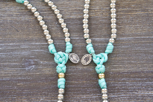 Kid's spiritual rosary: durable paracord construction in teal blue, accented with royal silver & gold beads.