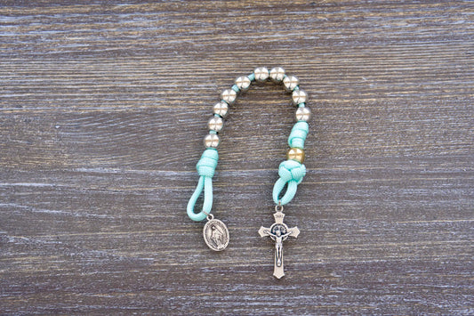 August Queen of the Heavens kids' paracord rosary with teal cord, royal silver and gold beads, 2" St. Benedict crucifix, and 3/4 inch Miraculous Medal
