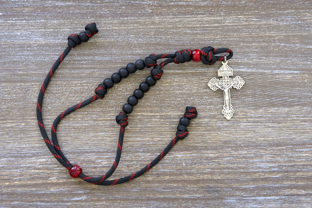 A beautifully crafted paracord rosary, designed to hang from your car's rearview mirror. Measuring approximately 9 inches when tightened and up to 13 inches in length.
