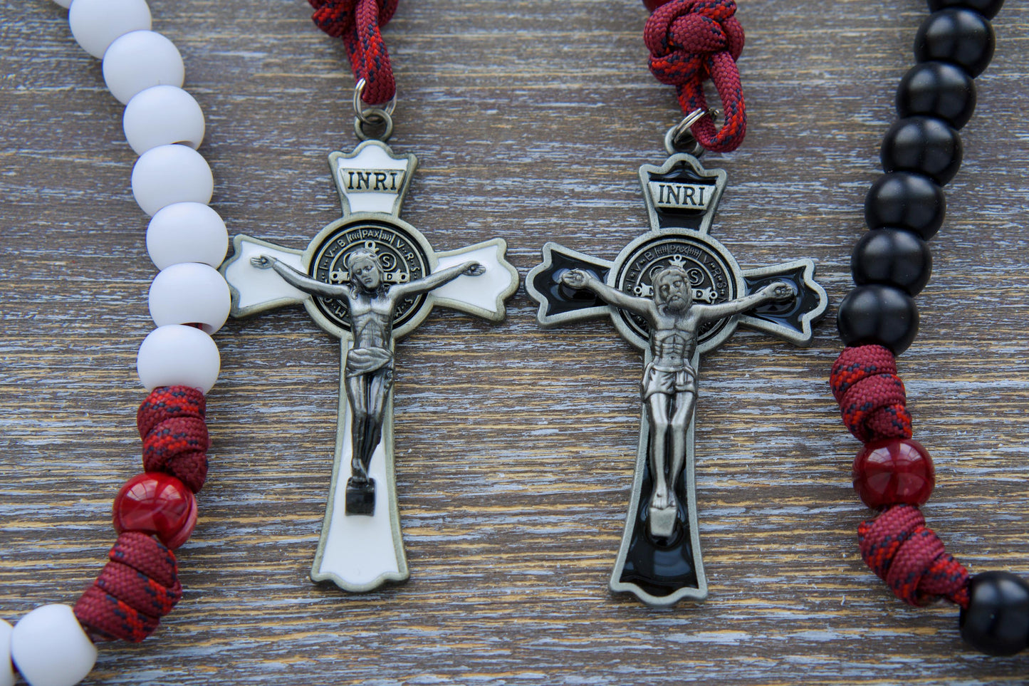 Handcrafted maroon red paracord rosary, "The Crimson Shield," featuring black or white Hail Mary beads, a gleaming black (or white) enamel St. Benedict crucifix, and a vibrant red Holy Spirit devotional medal. A Confirmation gift symbolizing faith.