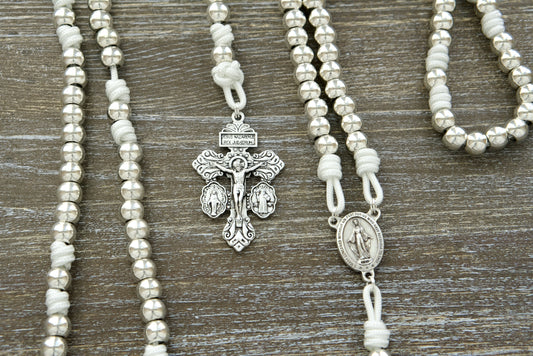 Divine Elegance - Miraculous Medal Paracord Rosary: Unbreakable white paracord, silver-colored beads and alloy metal accents with a Miraculous Medal centerpiece and 2" Pardon Crucifix.