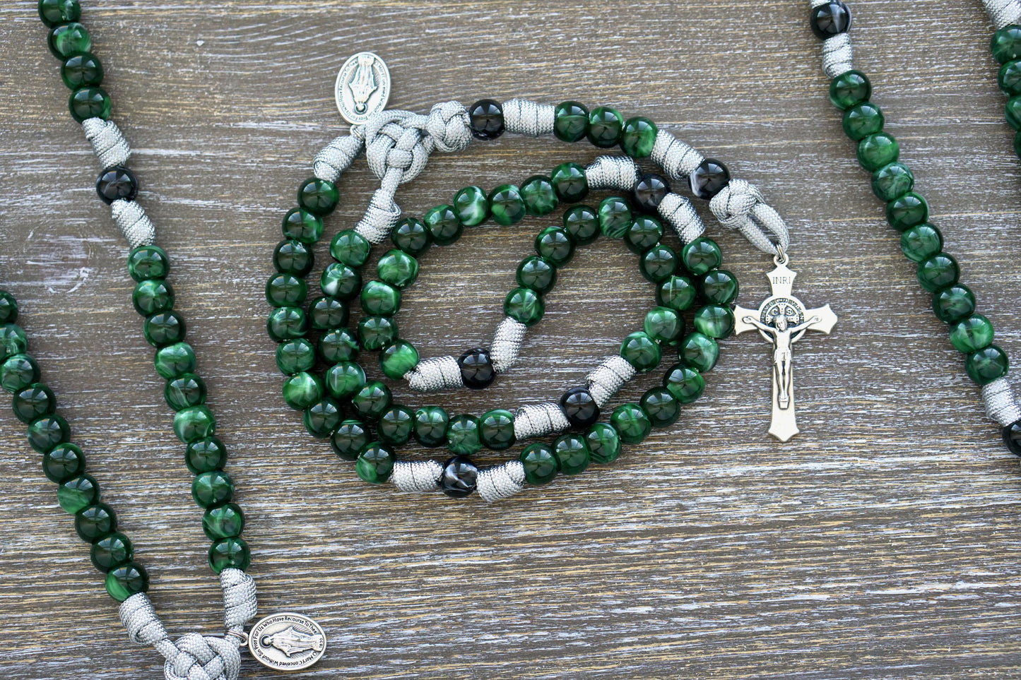 Gemstone Colored - 5 Decade Paracord Rosary with St. Benedict Crucifix and Miraculous Medal, featuring options in Garnet Red, Ingolite Blue, Emerald Green, or Magenta.