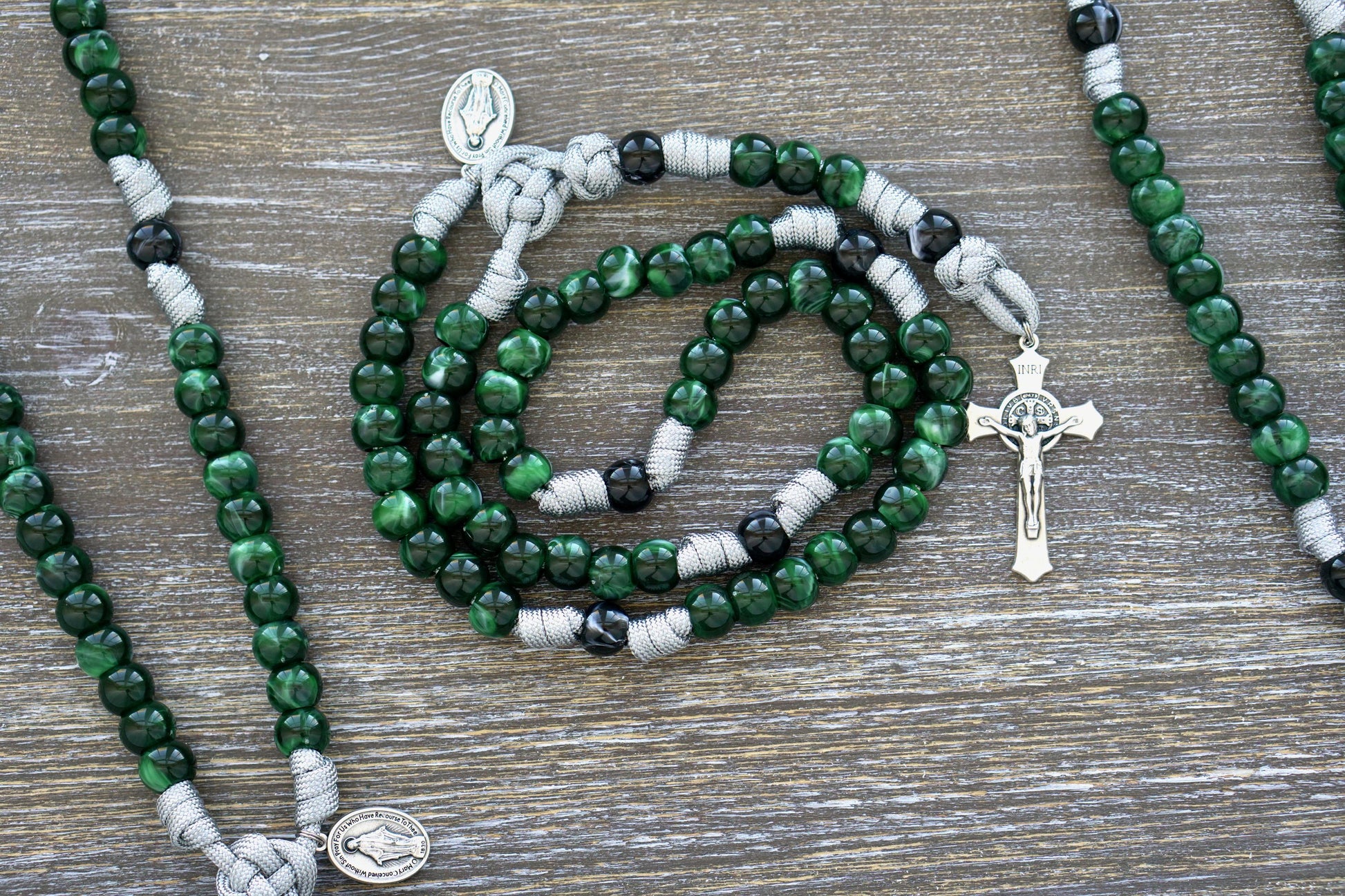 Gemstone Colored - 5 Decade Paracord Rosary with St. Benedict Crucifix and Miraculous Medal, featuring options in Garnet Red, Ingolite Blue, Emerald Green, or Magenta.