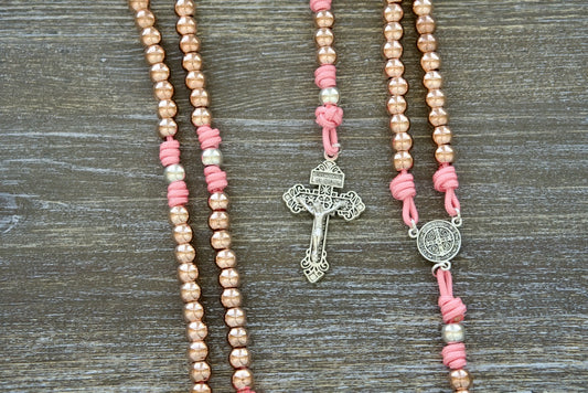 Heavenly Halo rosary: rose gold, pink, silver paracord beads with St. Benedict medal and sleek metal design.