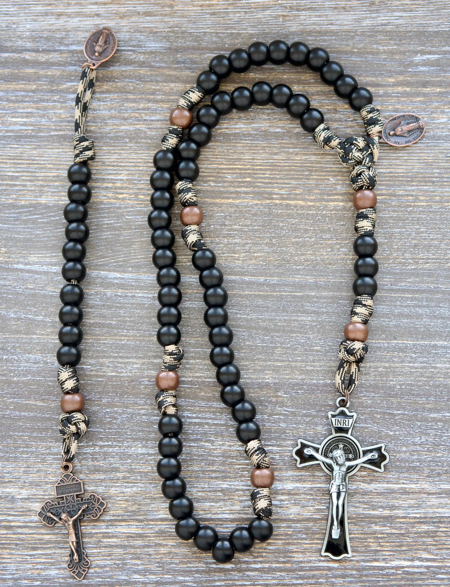 Black enamel St. Benedict crucifix tops Heavy Duty Hail Mary paracord rosary with coffee, copper, and black camo rope.