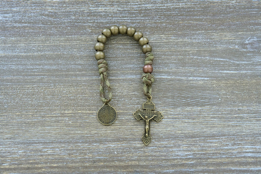Holy Defense Pocket Paracord Rosary: Camo paracord, copper Our Father, olive Hail Mary beads, St. Benedict medal, 2-inch Pardon Crucifix.