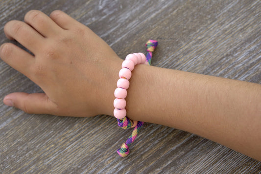 Little Lady's Miracle - Kid's Rosary Bracelet: Nurture young Catholic souls with this unique pink/green/orange paracord rosary bracelet featuring petite 10mm pink beads and matching orange Our Father beads.