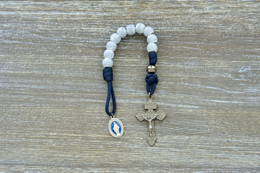 Marian Stronghold Pocket Paracord Rosary: navy rope, 12mm acrylic beads, gunmetal Our Father, cracked ivory Hail Mary, 2-inch pardon crucifix.