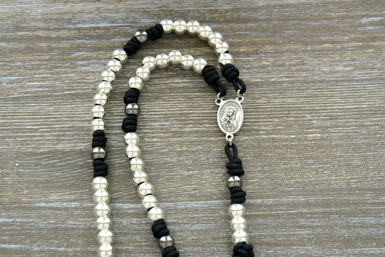 Black, silver, and gunmetal 7 Sorrows Servite Rosary - Handcrafted premium paracord chaplet with silver Hail Mary beads, gunmetal Our Father beads, Mater Dolorosa/Ecce Homo centerpiece, and a 2" Pardon Crucifix