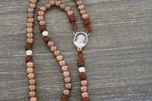 The St. Padre Pio Stainless Steel Paracord Rosary, a beautifully crafted rosary that honors the legacy of Saint Padre Pio and offers a unique blend of style and spirituality. This exquisite rosary features 10mm stainless steel antique copper Hail Mary beads, shiny silver 10mm stainless steel Our Father beads, and a stunning brown enamel St. Padre Pio medal.