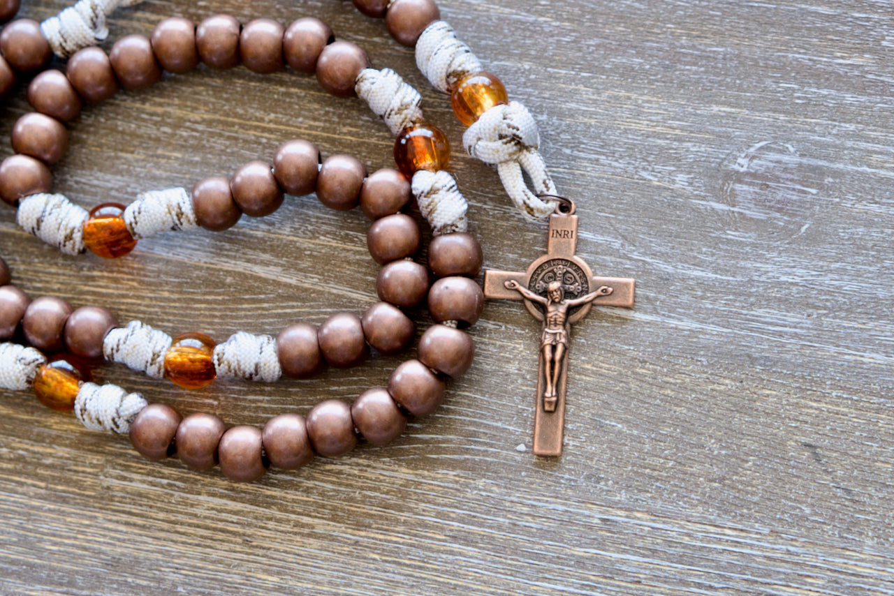 Our Lady of Mount Carmel - 5 Decade Paracord Rosary with antique copper Hail Mary beads, transparent brown Our Father beads, copper St. Benedict crucifix, and paracord rope featuring copper-infused strands.