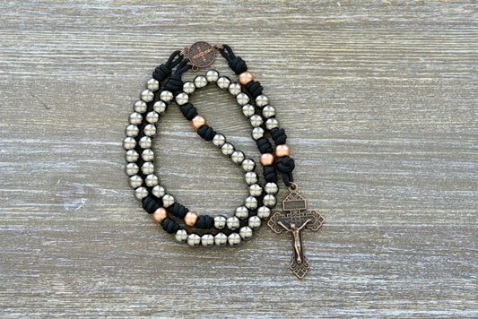 Path of the Disciple - Premium Metal Paracord Rosary featuring black paracord 275, elegant gunmetal Hail Mary beads, antique copper Our Father beads, and a stunning antique copper St. Benedict centerpiece; perfect for Catholics seeking strength in their devotional practices on the journey towards spiritual growth and closer intimacy with Jesus Christ.