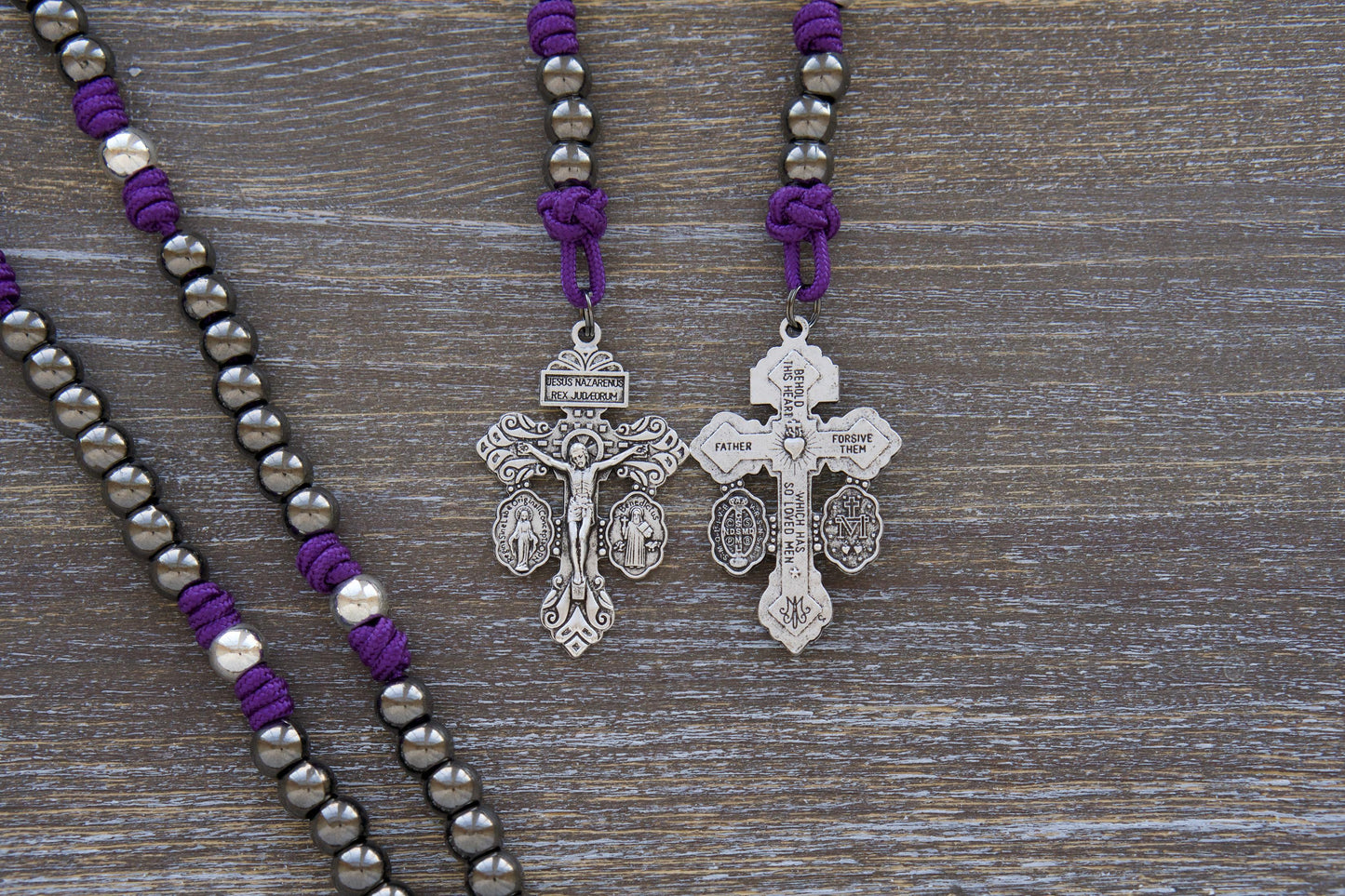 Premium silver and gunmetal "Mater Dolorosa" Servite Rosary Chaplet featuring a durable purple paracord, 10mm metal alloy beads, and a centerpiece medal depicting Our Lady of Sorrows and Ecce Homo. Includes a robust 'triple threat' pardon crucifix.