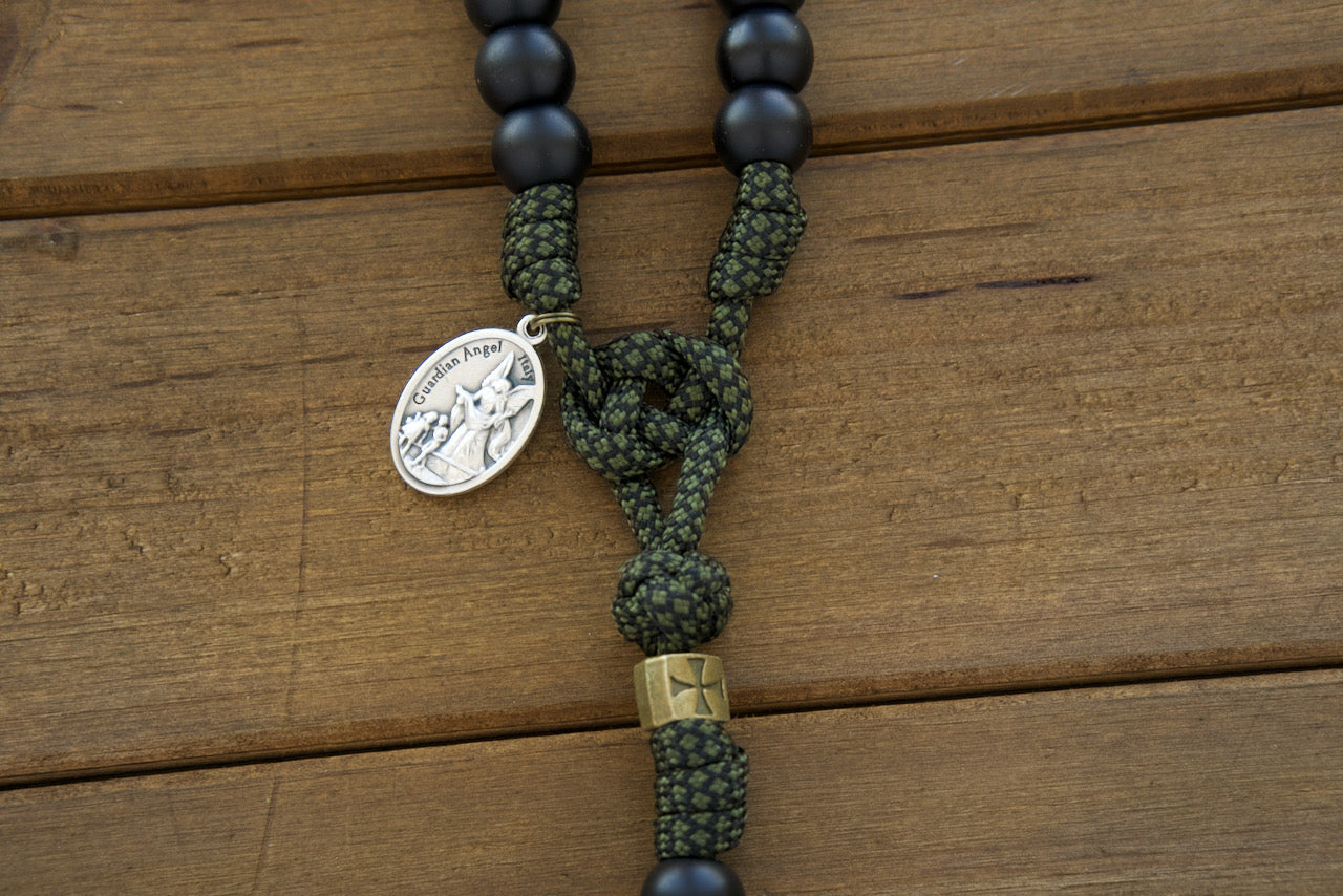 Shield of Faith - Green, Black and Olive - 5 Decade Paracord Rosary: Durable and stylish spiritual weapon for everyday battles. Handmade by a Catholic family, featuring green camo rope, matte black Hail Mary beads, bronze Crusader cross Our Father beads, and St. Michael/Guardian Angel medal.