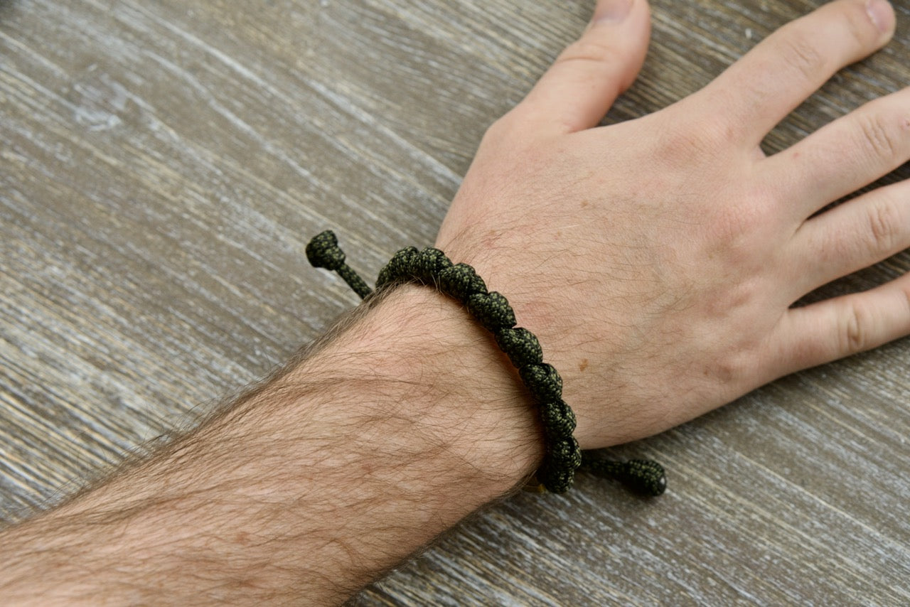 Shield of Faith - Rosary Bracelet: Durable olive metal alloy Our Father beads, 10 Hail Mary prayers, adjustable army green/black paracord rope, perfect spiritual armor for active Catholics, unbreakable Catholic gift.
