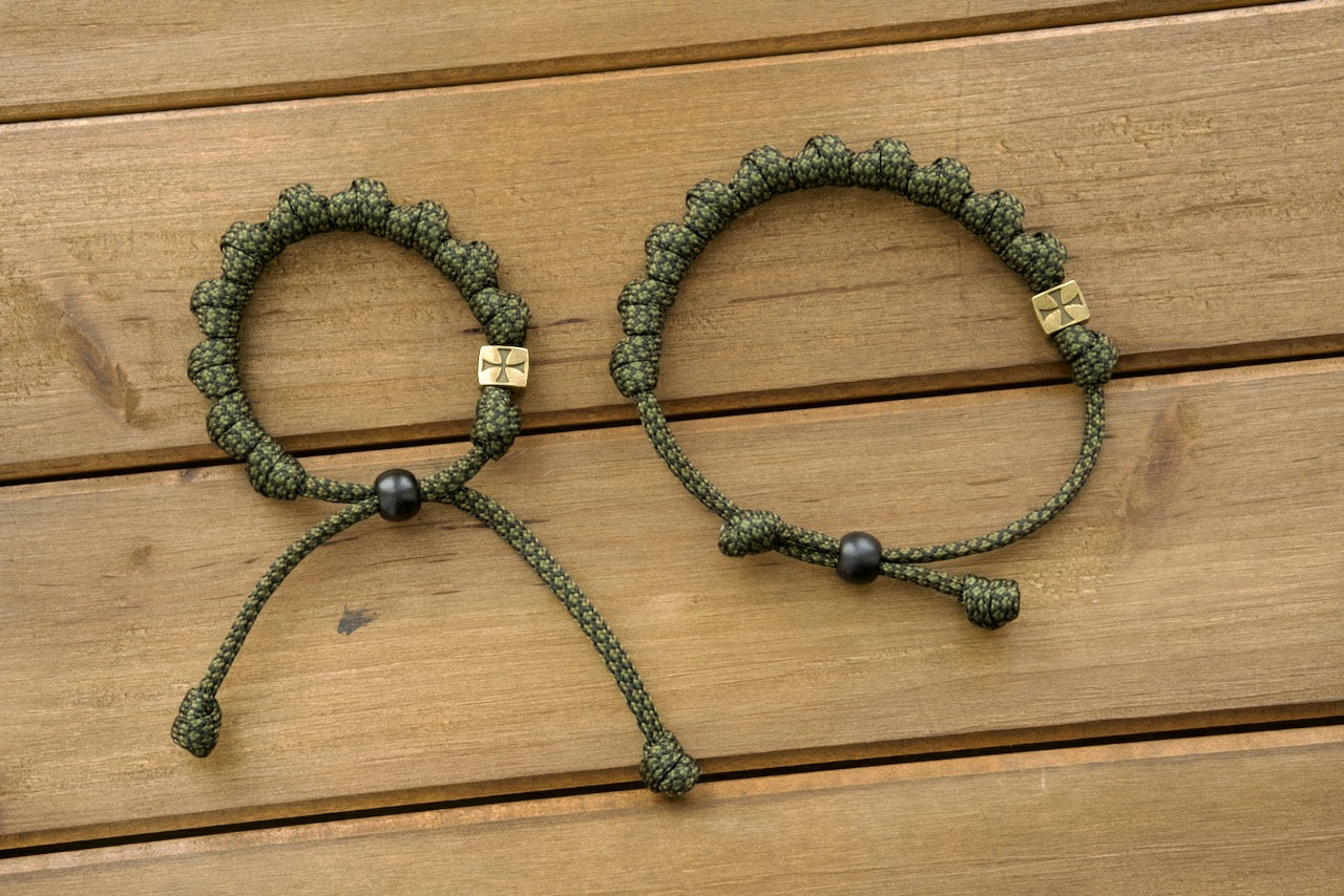 Shield of Faith - Adjustable Olive Metal Alloy Rosary Bracelet featuring durable army green/black paracord rope, perfect for active Catholics seeking spiritual protection. Unbreakable, comfortable, and versatile Catholic gift.