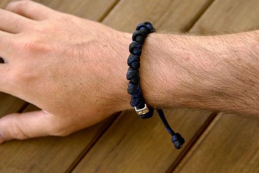 Discover the perfect blend of spirituality and durability with our new Solemn Crusader - Rosary Bracelet. Crafted with premium, unbreakable paracord 550 in black and blue for a unique Catholic gift that stands up to life's battles.
