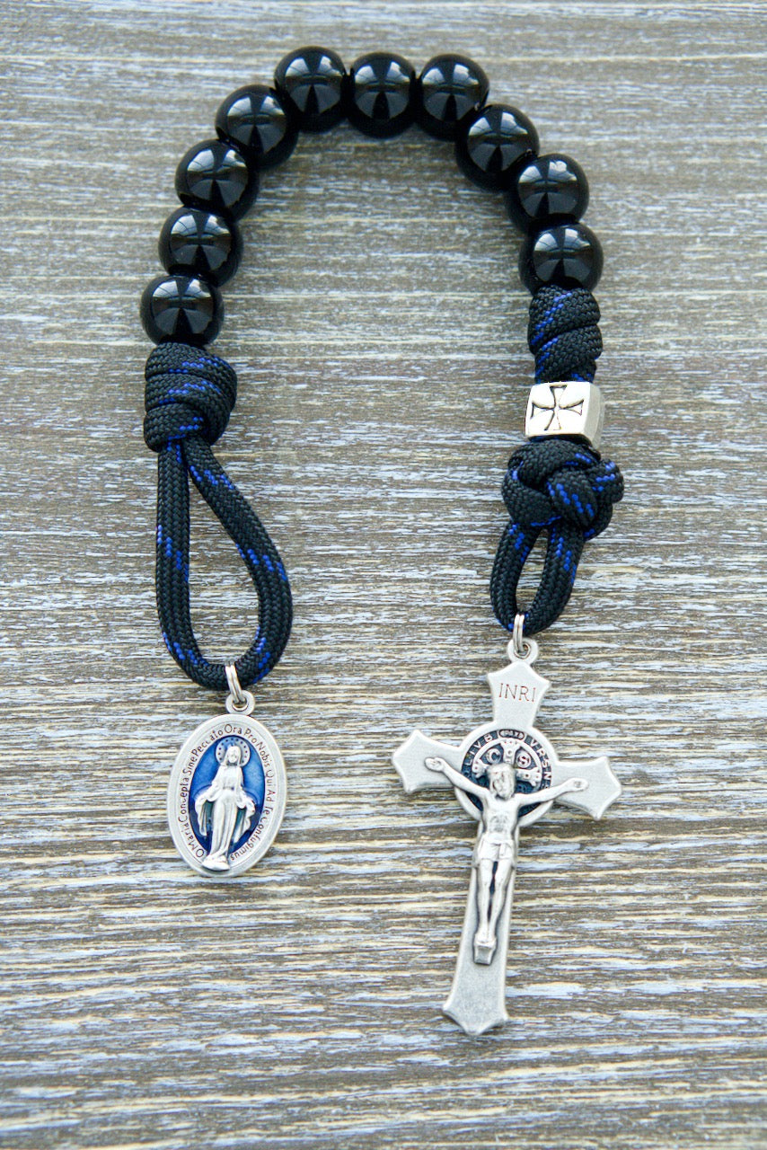 Embark on a solemn journey of devotion with our 'Solemn Crusader' Blue Black and Silver 1 Decade Paracord Rosary. Experience unwavering faith as you hold this durable, premium rosary crafted for those seeking strength in their Catholic journey.