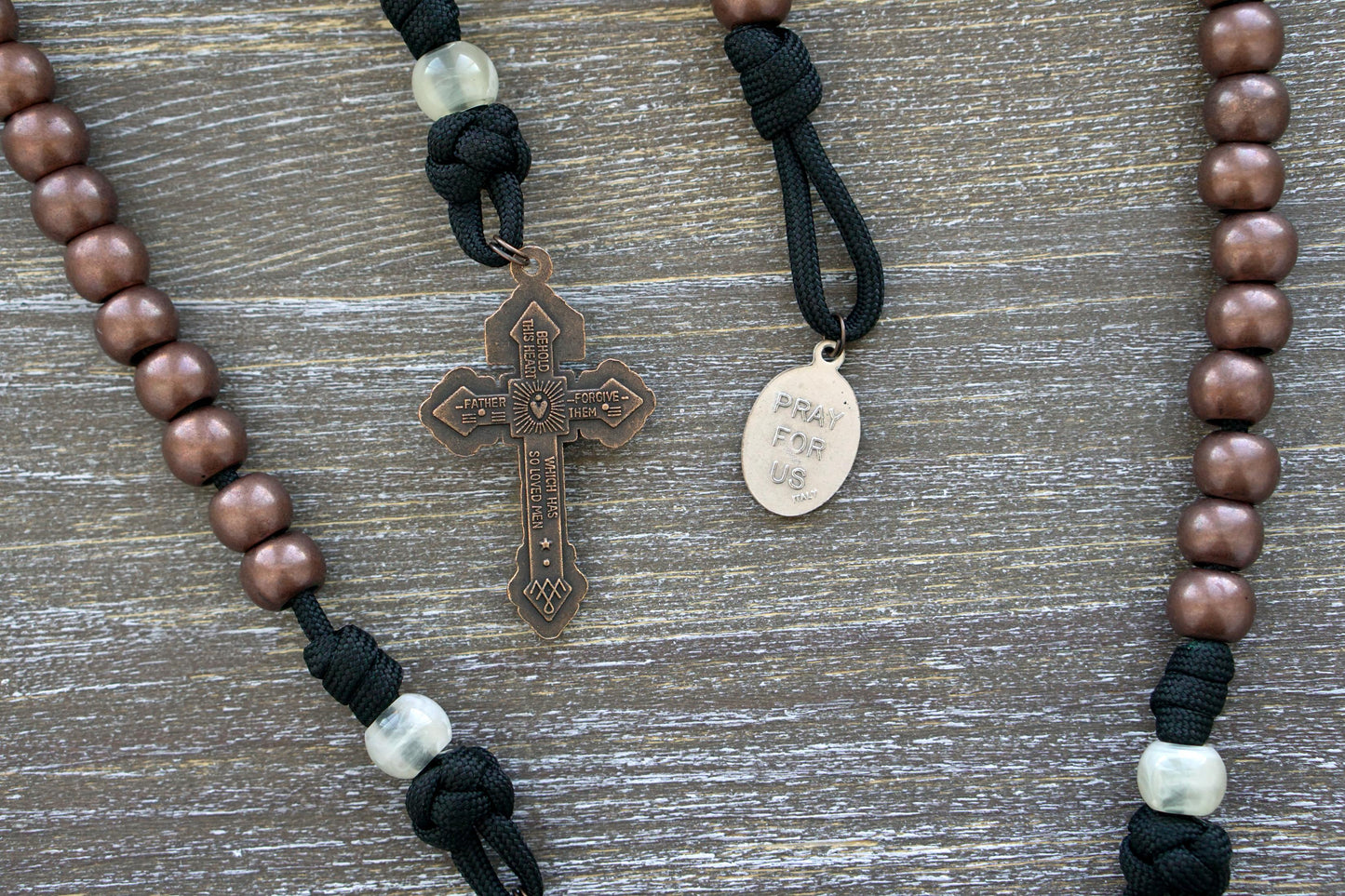 The Heretic Hammer - St. Anthony 5 Decade Paracord Rosary in black and copper, featuring a comfortable grip, durable construction, and inspirational design for daily prayers and devotionals.