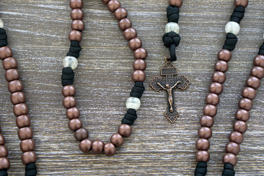 The Heretic Hammer - St. Anthony - 5 Decade Paracord Rosary: A stylish and meaningful rosary, featuring black paracord rope, copper and pearl beads, St. Anthony devotional medal, and a Pardon Crucifix.