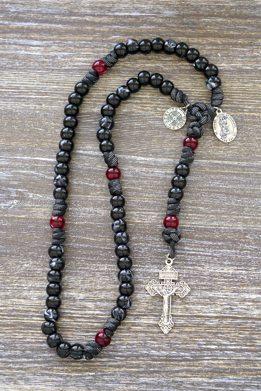 Terror of Demons - St. Joseph - 5 Decade Paracord Rosary with black/white luster Hail Mary beads, red/maroon Our Father beads, 2" silver pardon crucifix, and devotional medals of St. Joseph and St. Benedict.