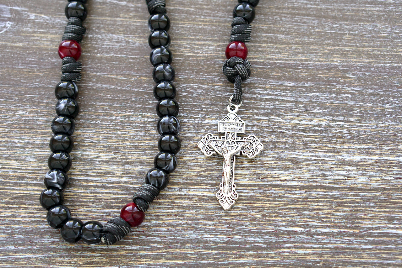 Terror of Demons - St. Joseph - 5 Decade Paracord Rosary - Protect yourself from evil with this bold, black/red rosary featuring St. Joseph medals and a silver pardon crucifix. Made with paracord 550 and acrylic beads.