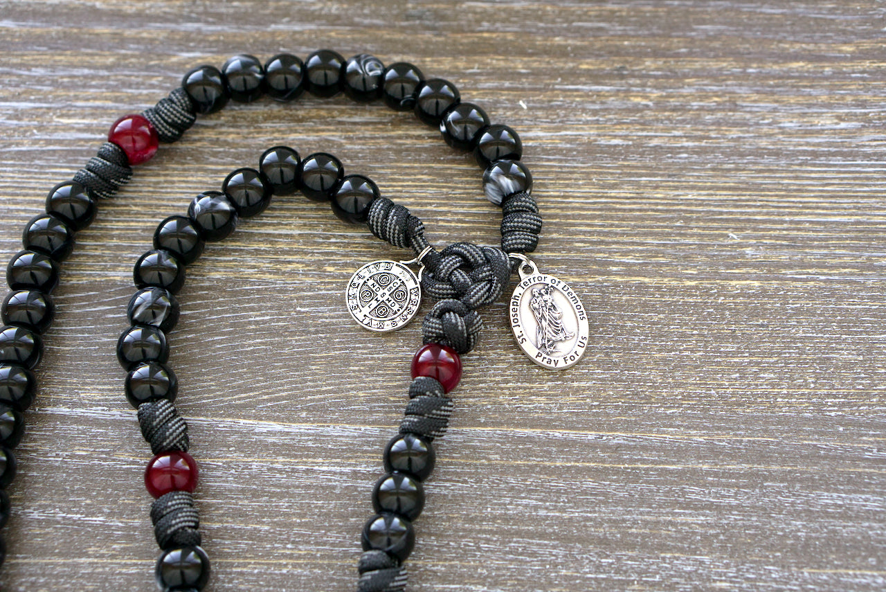 Terror of Demons - St. Joseph - Black and Red - 5 Decade Paracord Rosary with St. Joseph and St. Benedict Medals and 2" Silver Pardon Crucifix. Handmade spiritual weapon for prayer and protection against evil forces.