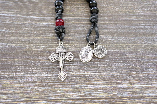 Terror of Demons - St. Joseph Paracord Rosary | Handmade Catholic rosary with black/white Hail Mary beads, red/maroon Our Father bead, and devotional medals of St. Joseph and St. Benedict on a 550 paracord with a 2-inch pardon crucifix.
