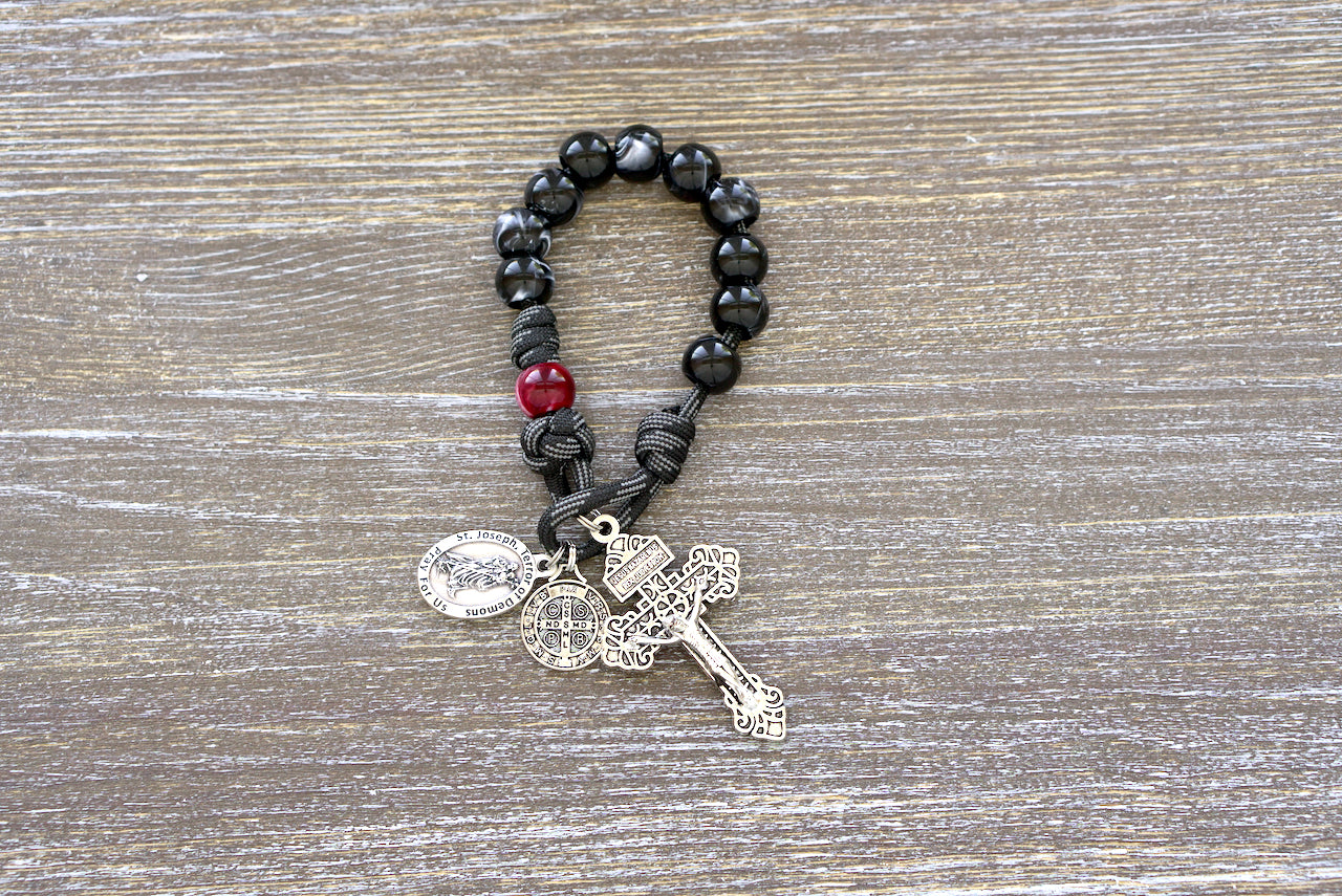 Terror of Demons - St. Joseph - Pocket Paracord Rosary: Strike against evil with this powerful, handmade paracord rosary featuring black/white Hail Mary beads and red/maroon Our Father bead, crafted in honor of St. Joseph as the Terror of Demons. Perfect for spiritual warriors on-the-go.