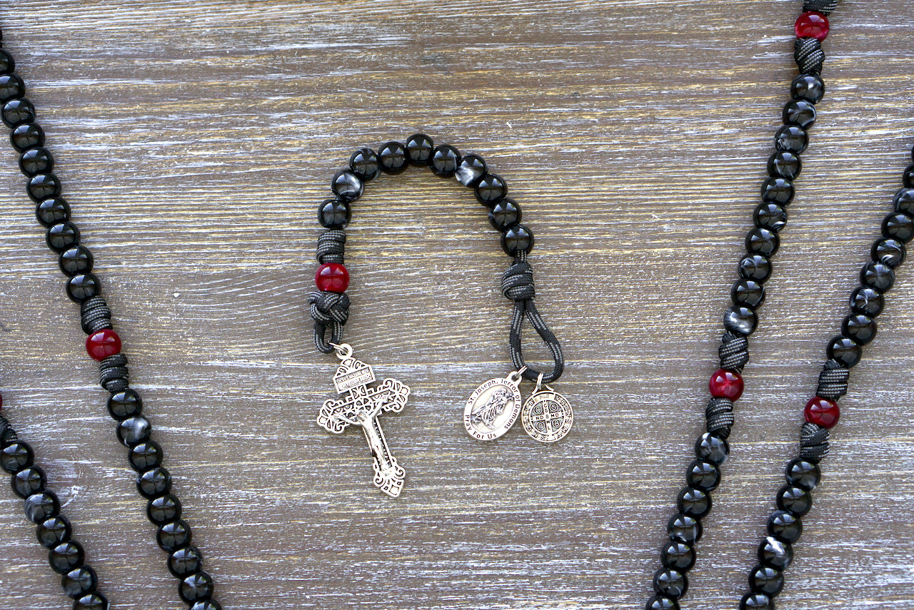 Terror of Demons - St. Joseph - Pocket Paracord Rosary with black/white Hail Mary beads, red/maroon Our Father bead, and St. Joseph medal; perfect for spiritual protection and devotion on-the-go.