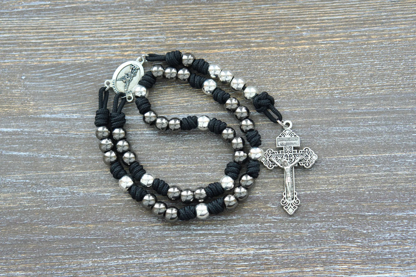 Sturdy black, blue, or green paracord chaplet featuring silver St. Michael medal and 10mm metal alloy beads.