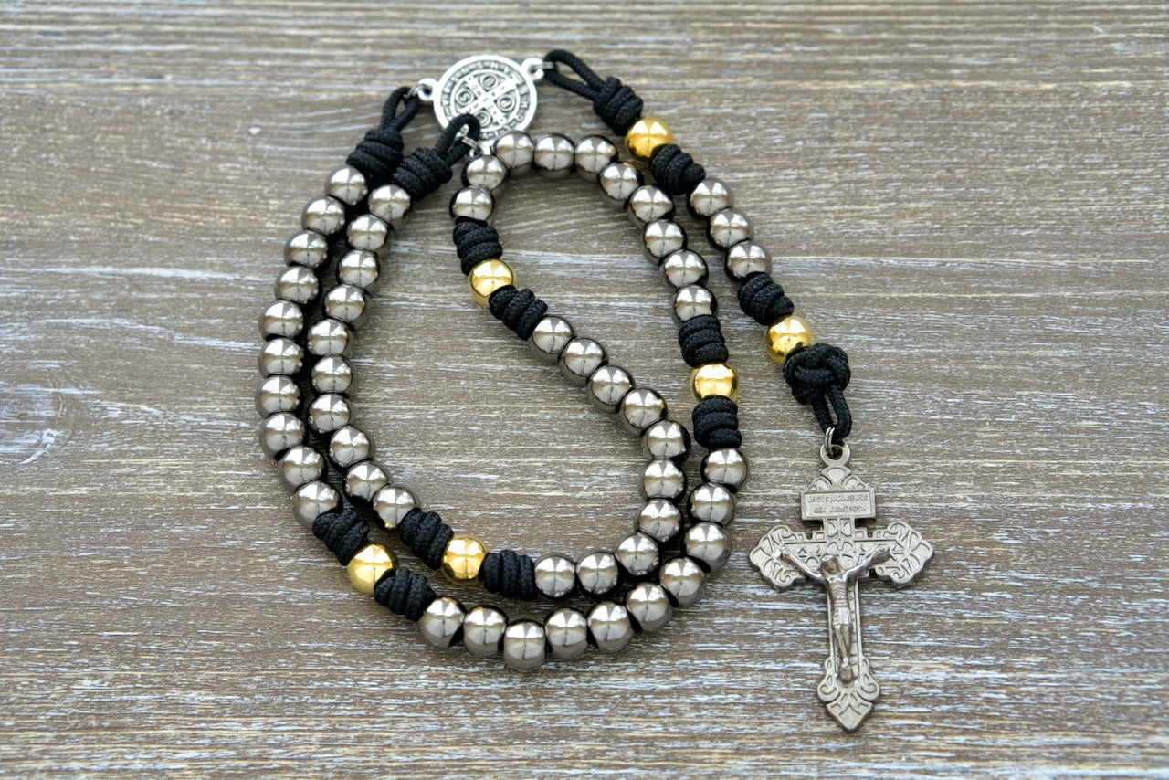 Stronghold of Grace | Gunmetal, Gold and Black Premium Metal Rosary - Durable Paracord 275 Catholic Rosary with St. Benedict Medal and 2-inch Pardon Crucifix for daily faith battles (Sanctus Servo)