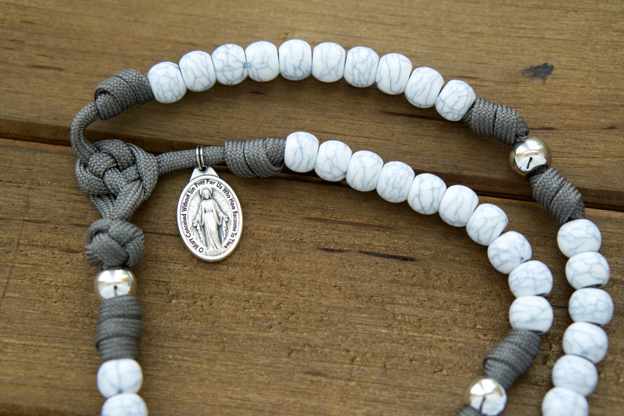 The Faithful Fortress - Gray, Ivory and Silver - 5 Decade Paracord Rosary, a durable and unbreakable Catholic gift for your daily prayer life. Handmade by a small Catholic family, featuring Miraculous Medal and St. Benedict Crucifix.