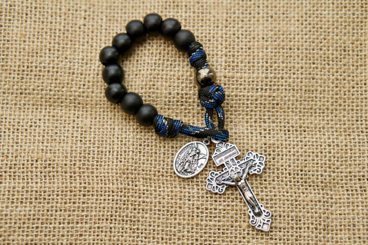 Thin Blue Line - 1 Decade Paracord Rosary, the ultimate spiritual weapon for LEOs featuring St. Michael as the devotional medal. This durable and unbreakable paracord rosary is perfect for pocket carry and makes a great Catholic gift for your family members in law enforcement.