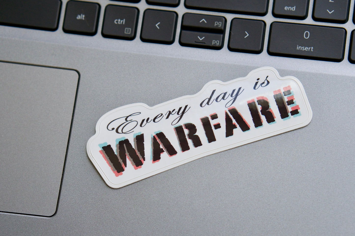 Every day is WARFARE - Vinyl Sticker for Christians, 4" x 1.5", perfect for laptops, water bottles, and notebooks. Spread the message and fight the spiritual battle with this powerful reminder.