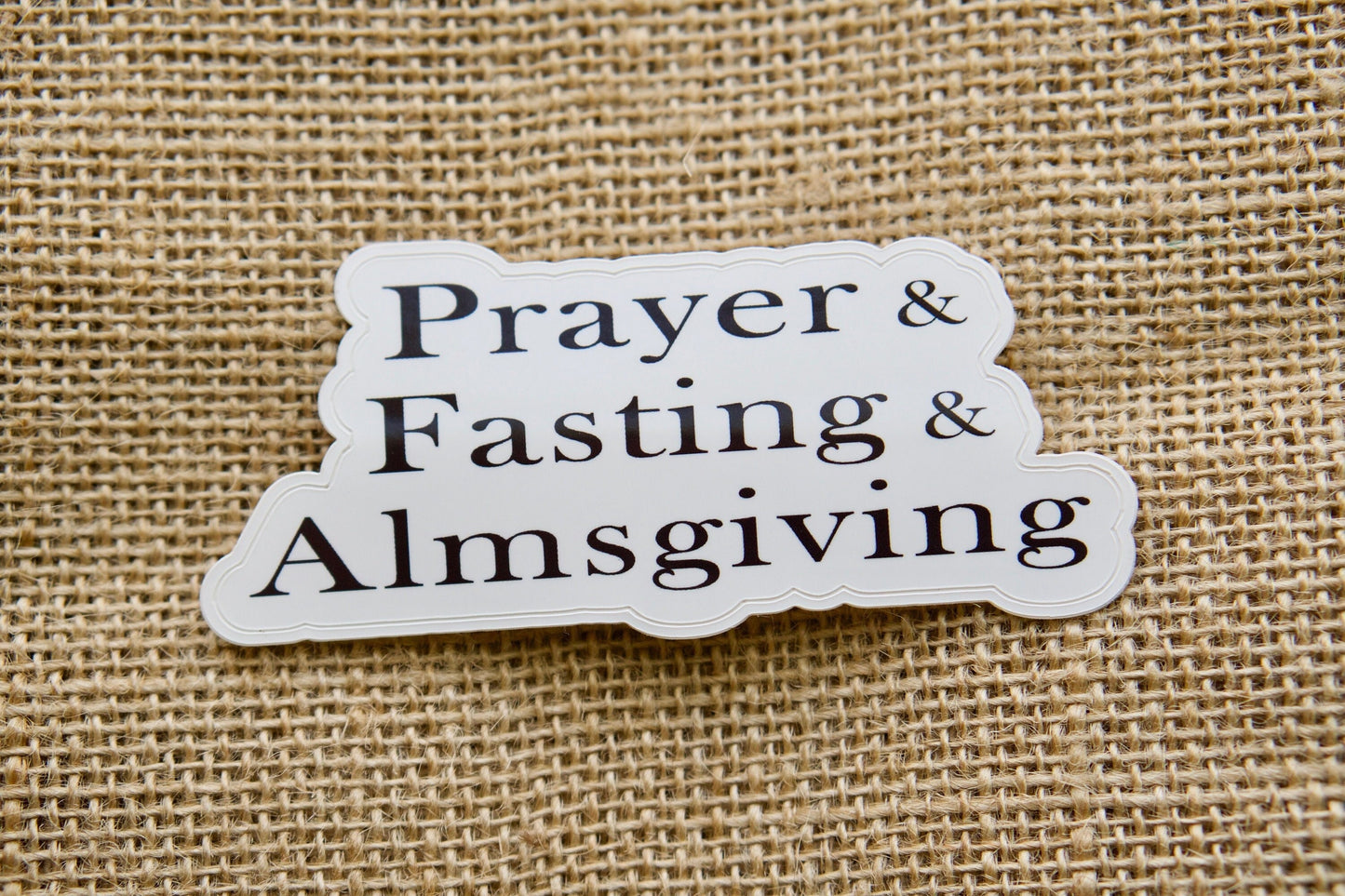 Join the spiritual battle with Prayer, Fasting, Almsgiving - Vinyl Sticker for Christian warriors; increase your faith weapons with a pocket-sized rosary from our Etsy shop. Perfect size for laptops, water bottles, and notebooks.