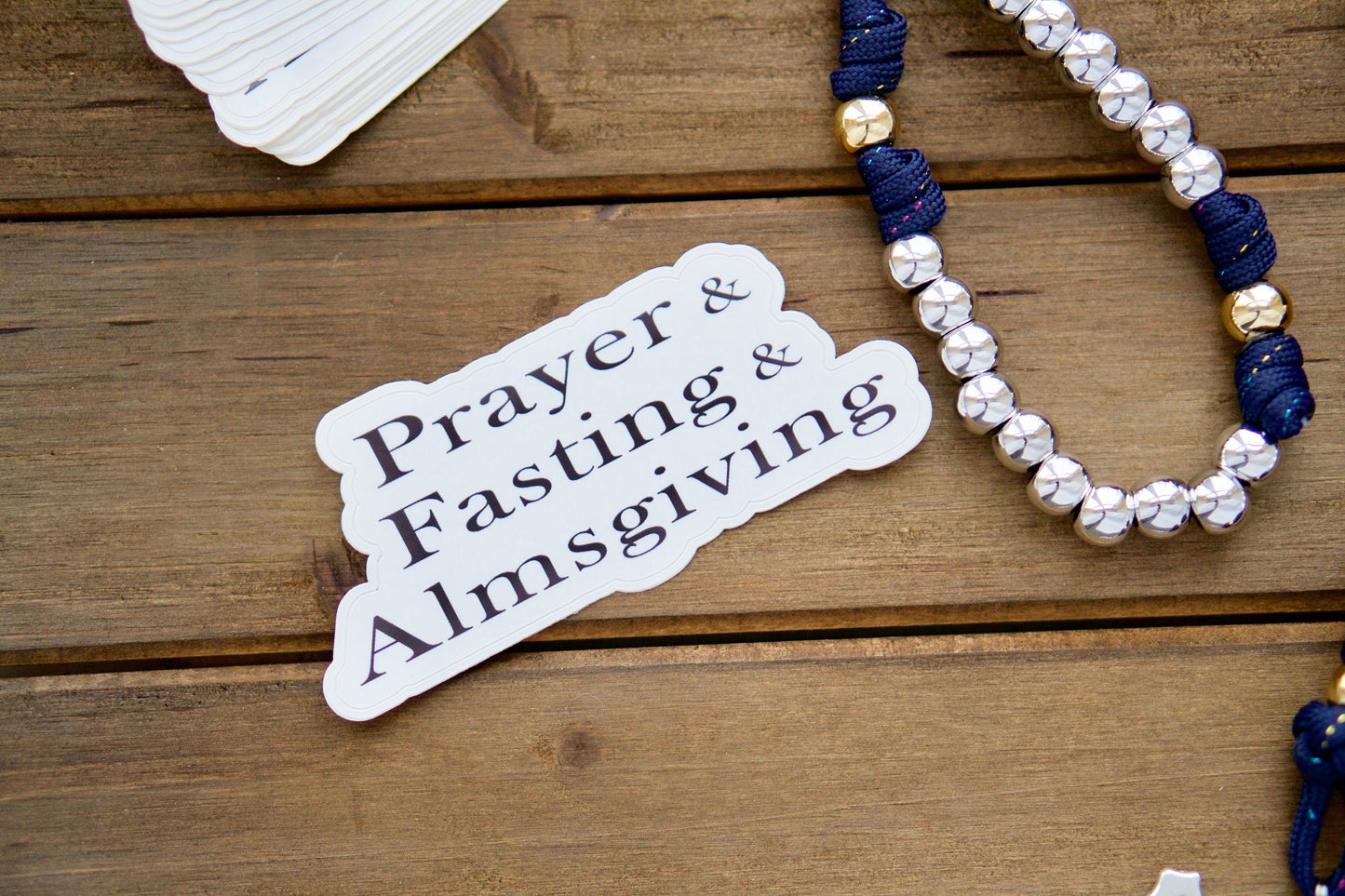 Join the fight in the spiritual war with Prayer, Fasting, Almsgiving - Vinyl Sticker. This powerful reminder promotes an increase in devotion for the conversion of sinners and release of souls in Purgatory. Perfectly complements our unbreakable paracord rosaries, making it a thoughtful Catholic gift.