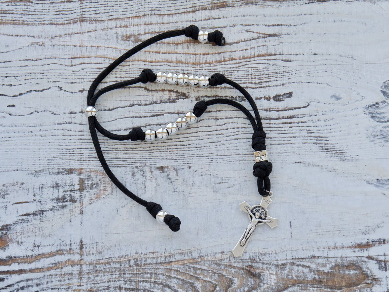Black and Silver Crusader - Rearview Mirror Paracord Rosary for Catholic drivers, featuring durable paracord, adjustable length, and St. Benedict crucifix.
