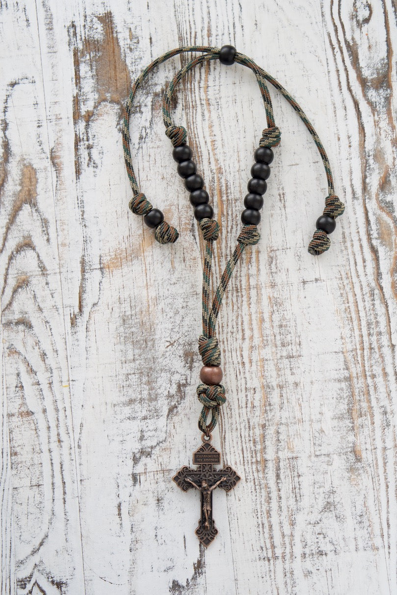 Camo and Copper Rearview Mirror Paracord Rosary for Catholics, featuring adjustable length, durable paracord, and a 13-inch expandable range. Perfect gift for drivers seeking to keep their faith close on the go!