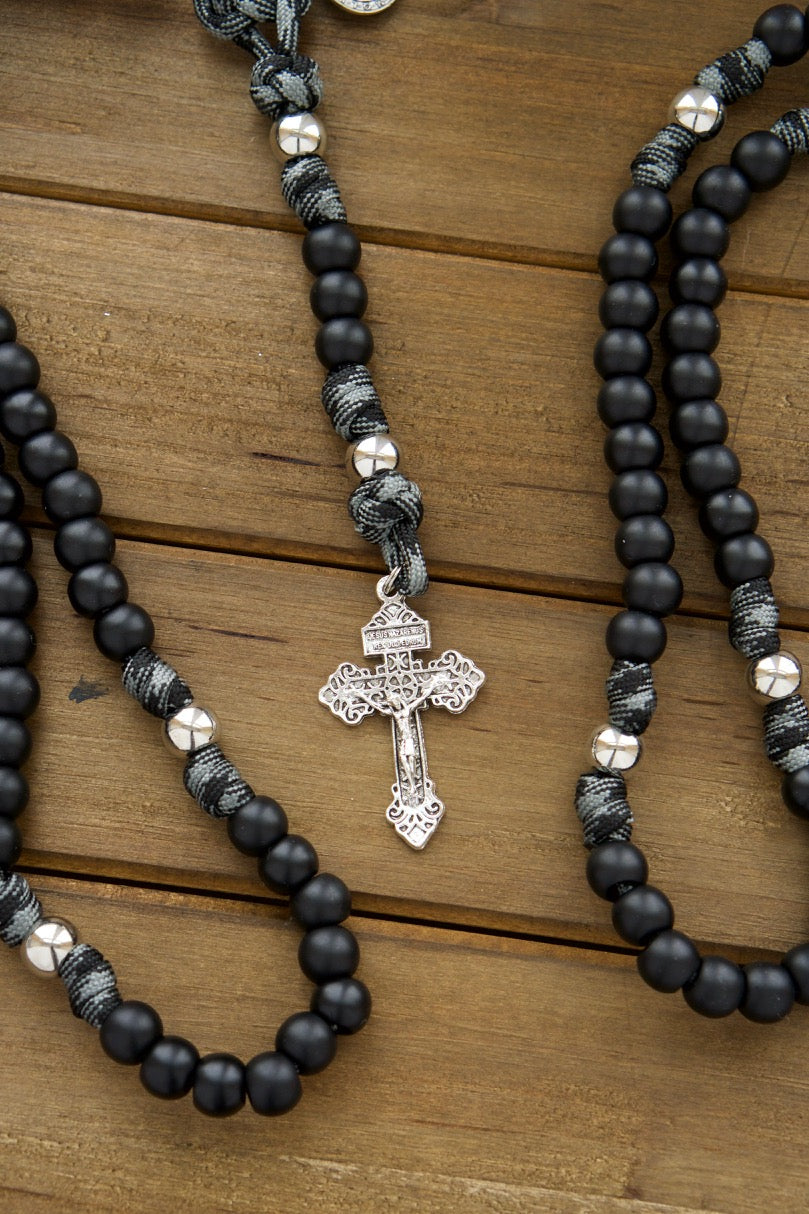 Another photo showing several Demon Destroyer paracord rosaries designed and sold by Sanctus Servo.