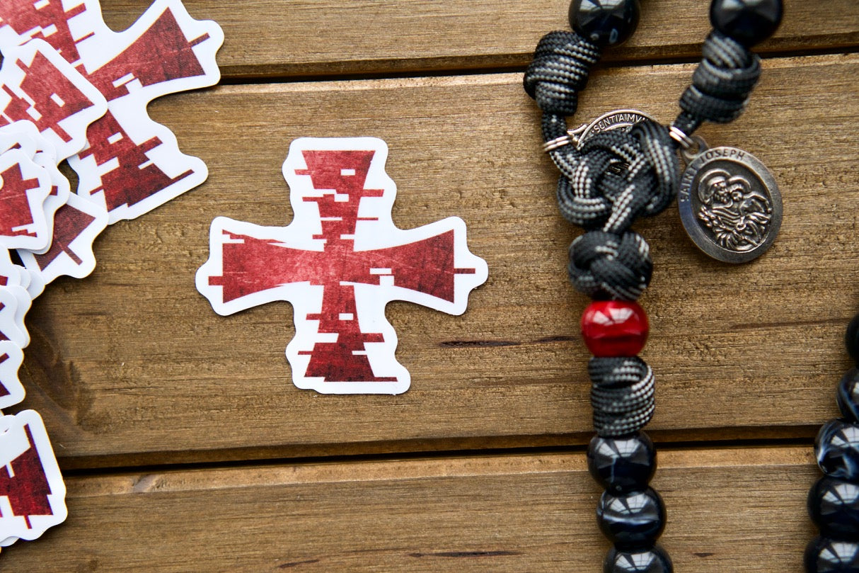 A set of nine durable vinyl stickers featuring diverse Catholic imagery and mottos, perfect for laptops, water bottles, notebooks, and more. Spread the faith with inspiring messages inspired by St. Maximilian Kolbe's Militia of the Immaculata, encouraging prayer and spiritual armor.