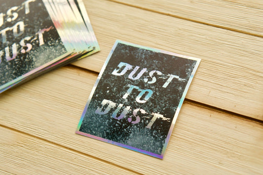 Dust to Dust - Holographic Vinyl Sticker. Waterproof, dishwasher & microwave safe. Spread the faith with this powerful reminder of Genesis 3:19. 2.54" x 3". Removes without residue.