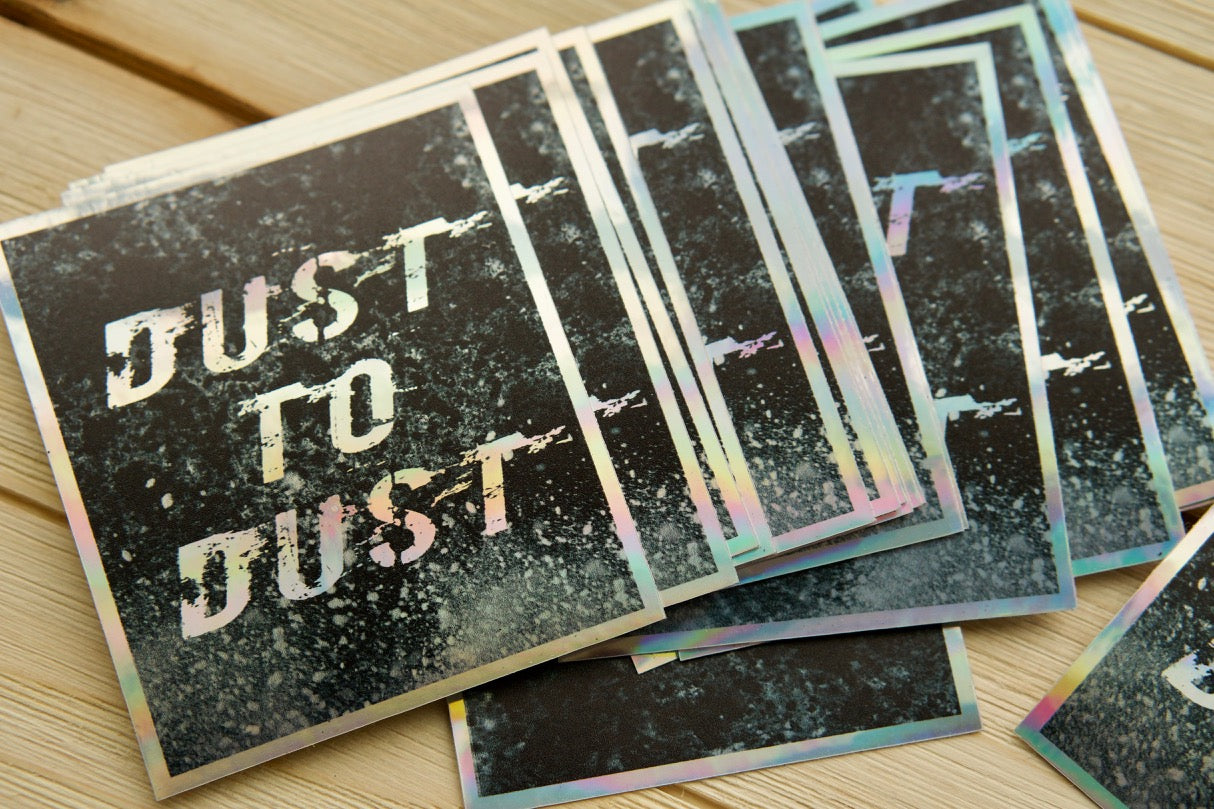 Holographic vinyl sticker with the words 'Dust to Dust' on it, featuring Genesis 3:19 quote reminding us of our mortality and the importance of spreading faith. Waterproof, dishwasher safe, and residue-free for easy application.