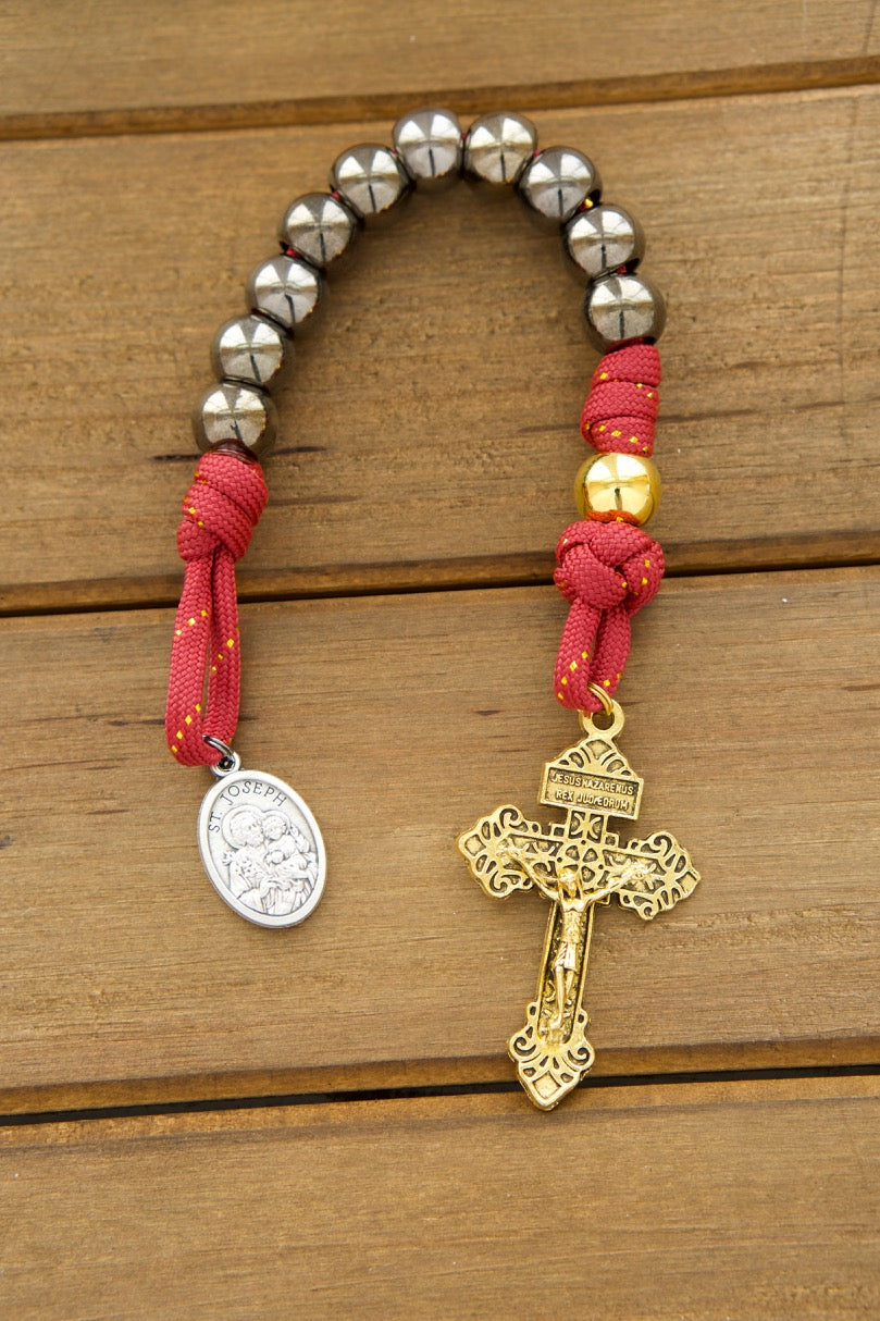 Holy Family 1 Decade Paracord Rosary - Durable, Premium Catholic Gift for Prayer Warriors (Red, Gold, Gunmetal Design) with Antique Gold Pardon Crucifix and St. Joseph Medal. Handmade by a small Catholic family for kids and adults.