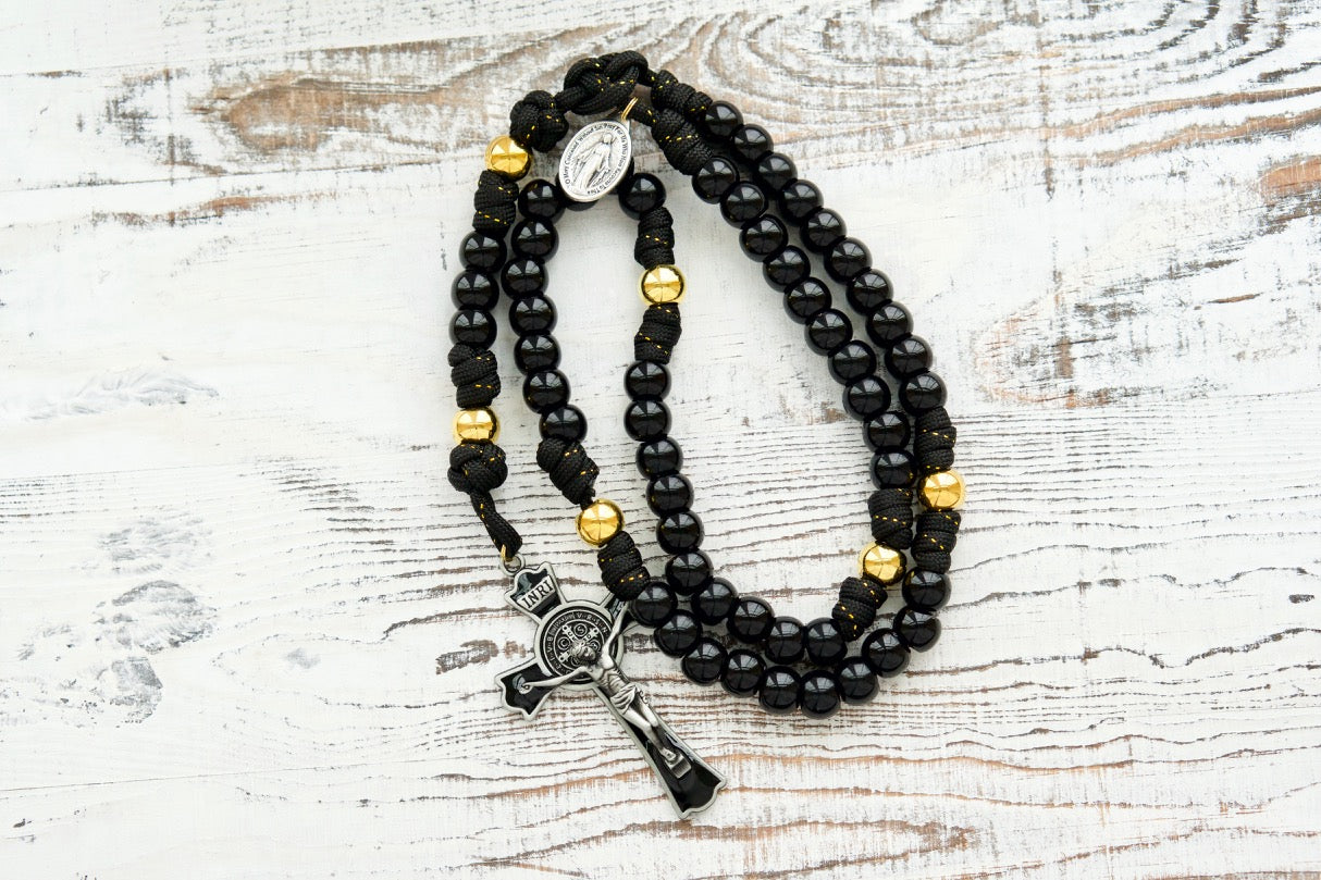 The Holy Servant - Black and Gold - 5 Decade Paracord Rosary: A stylish and durable rosary with elegant black rope, gold ribbon, and premium beads; perfect for prayer and gifting.