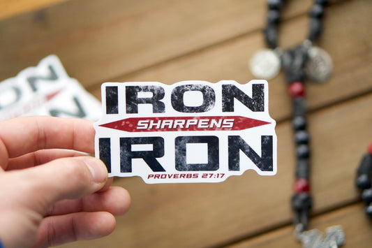 Inspired by Proverbs 27:17, "Iron sharpens iron, and one man sharpens another," this sticker serves as a daily reminder that we must never grow complacent in our battle against evil. Measuring at 4" wide and 2.25" tall, it's the perfect addition to any surface, whether on your car, laptop, or water bottle.