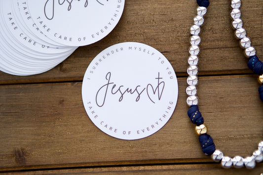 Surrender Prayer Vinyl Sticker - A powerful reminder of Jesus' care, 3" x 3", perfect for laptops & car windows. Waterproof, dishwasher & microwave safe, and leaves no residue when removed. Pair with our rosaries to spread the faith!